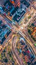 Vibrant Aerial View of Urban Traffic Junction at Night