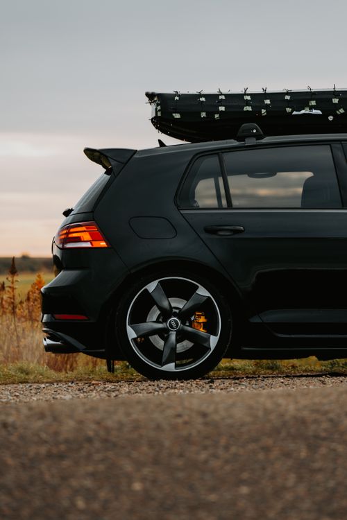 Blacked Car Racks Sleek Black Car with Roof Rack in Scenic Landscape · Free Stock Photo