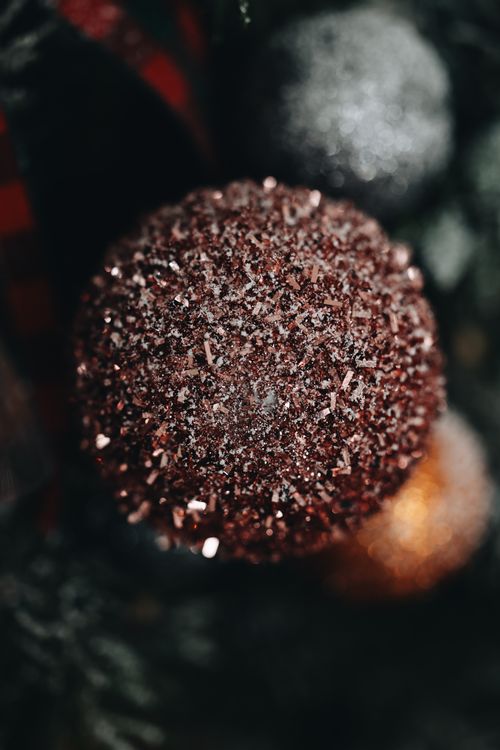 Free Detailed view of a glittering Christmas ornament on a festive tree. Stock Photo