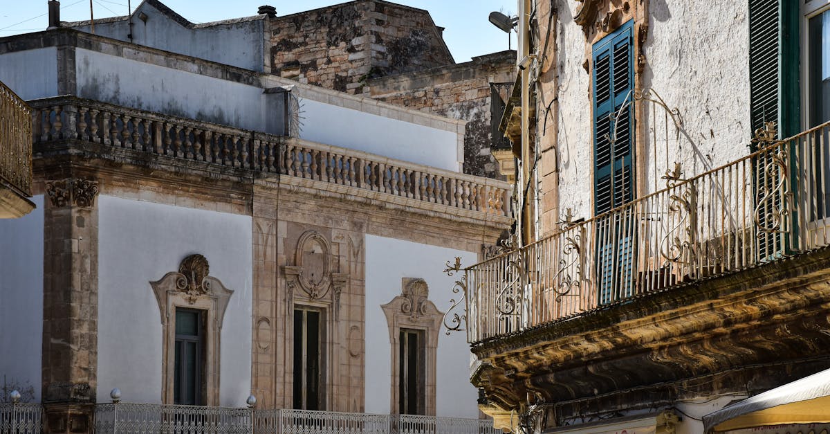 Charming view of historic Italian architecture in Apulia, showcasing detailed facades and rustic charm.
