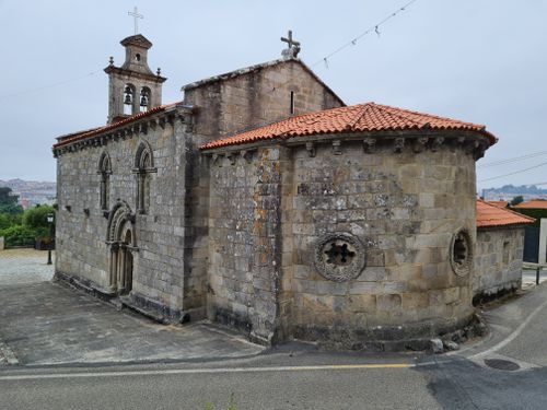 Free Charming historic stone church with Romanesque details and red tiled roof. Stock Photo