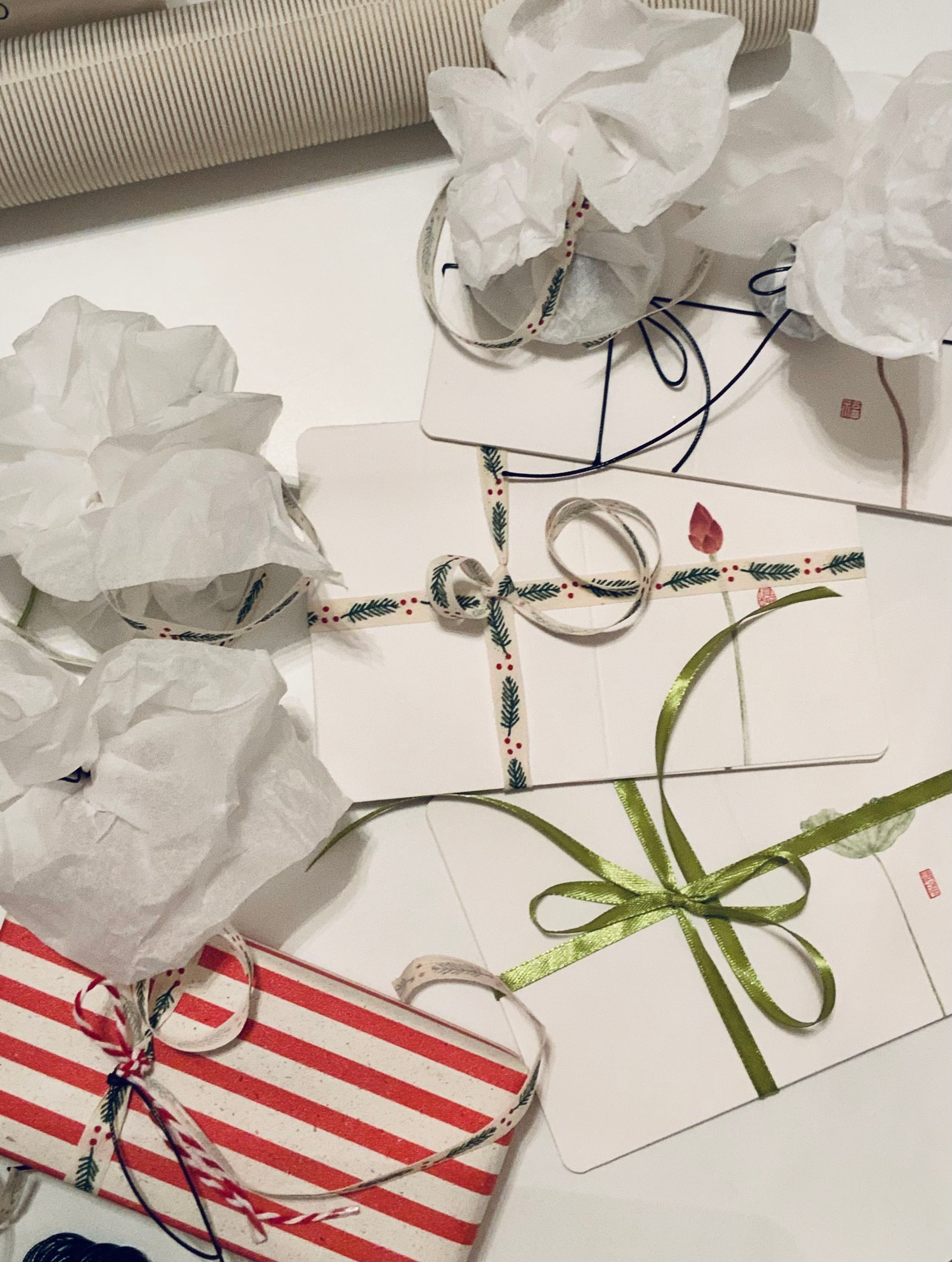 Festive Gift Wrapping with Creative Ribbons · Free Stock Photo