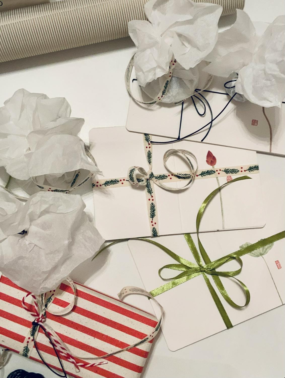 Festive Gift Wrapping with Creative Ribbons · Free Stock Photo