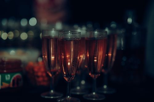 Free Close-up of champagne glasses at a party, capturing a festive atmosphere. Stock Photo