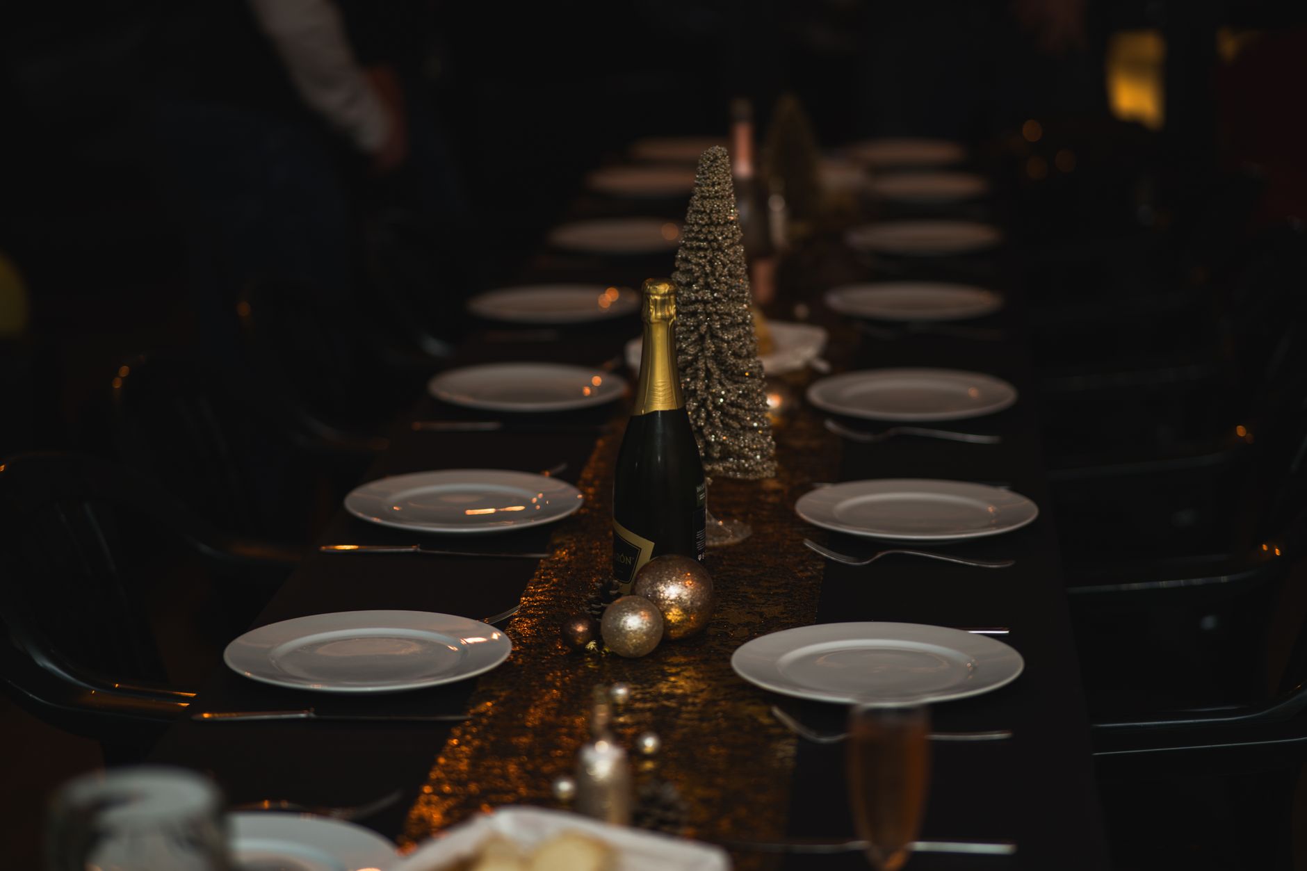 elegant table set for dinner in dark room