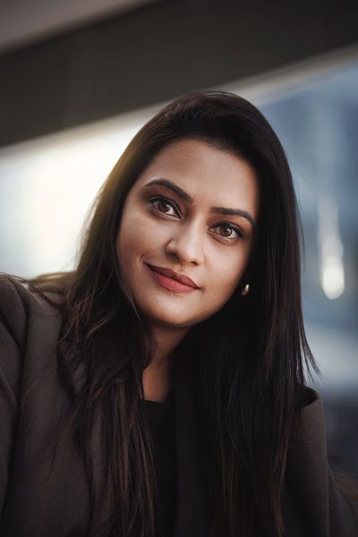 Confident professional woman smiling in business attire