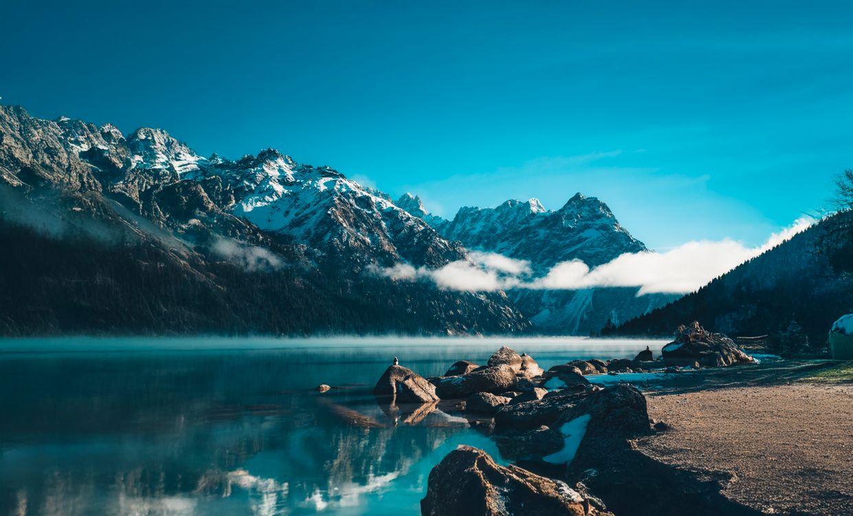 Scenic Mountain Lake View with Snowy Peaks · Free Stock Photo