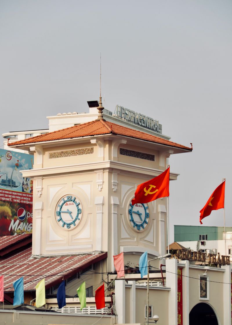 The clock tower of Bến Thành Market against a clear sky