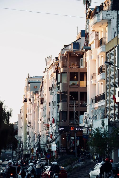Free A lively street in Đà Lạt, Vietnam with vibrant buildings and busy traffic during the day. Stock Photo
