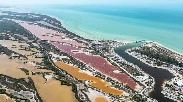 Explore the colorful salt ponds and stunning coastline of Sisal, Yucatán from above.
