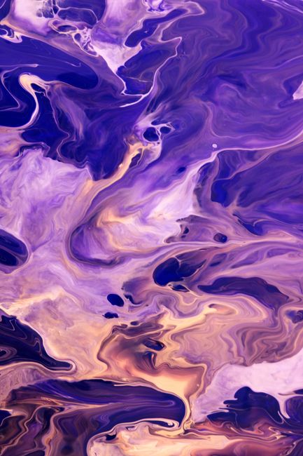 Dynamic abstract artwork featuring vibrant purple and gold swirling patterns with a fluid art style.