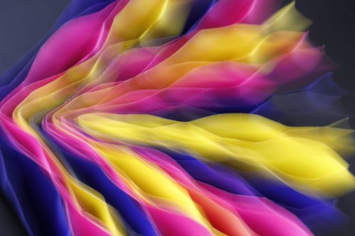 Free Abstract image showcasing vibrant waves of pink, yellow, and blue fabric. Dynamic, artistic, and colorful. Stock Photo