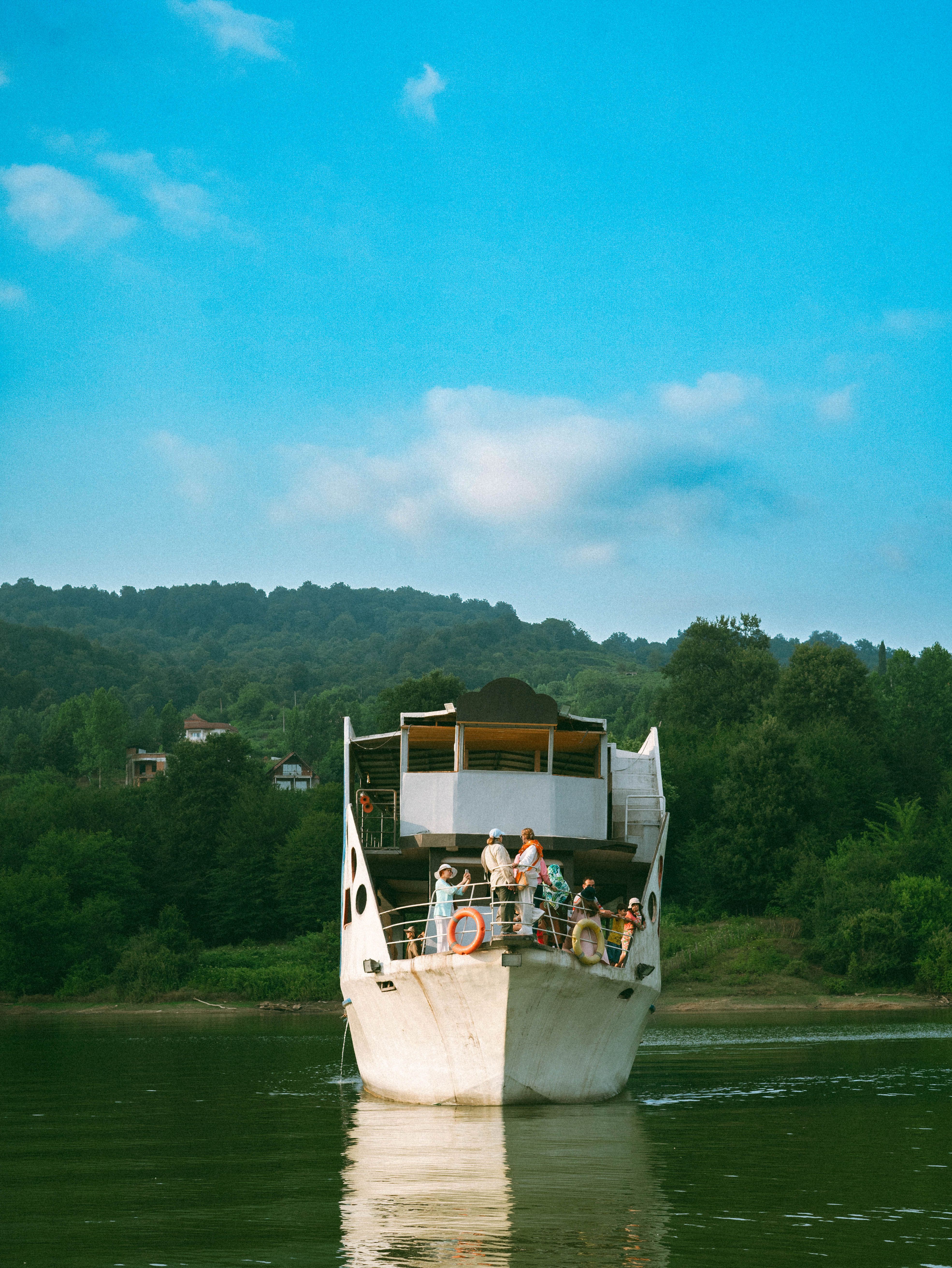 Scenic River Boat Ride in Serene Landscape · Free Stock Photo