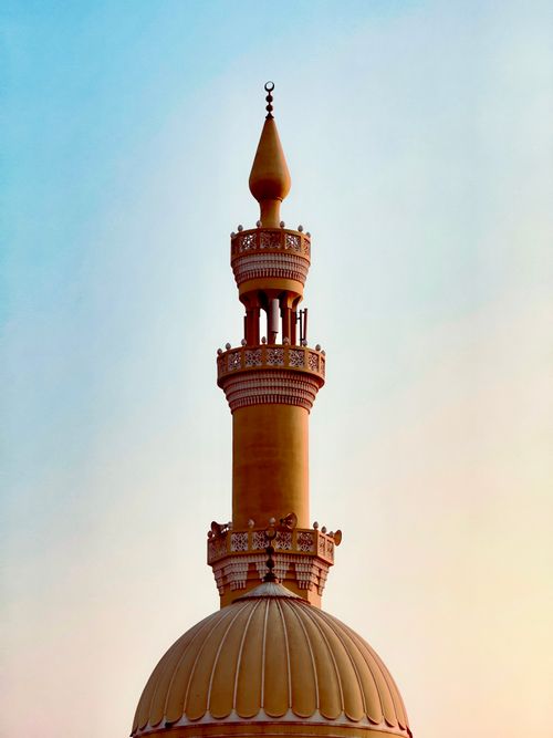 Free Stunning minaret and dome against a twilight sky in Dubai, UAE, showcasing Islamic architecture. Stock Photo
