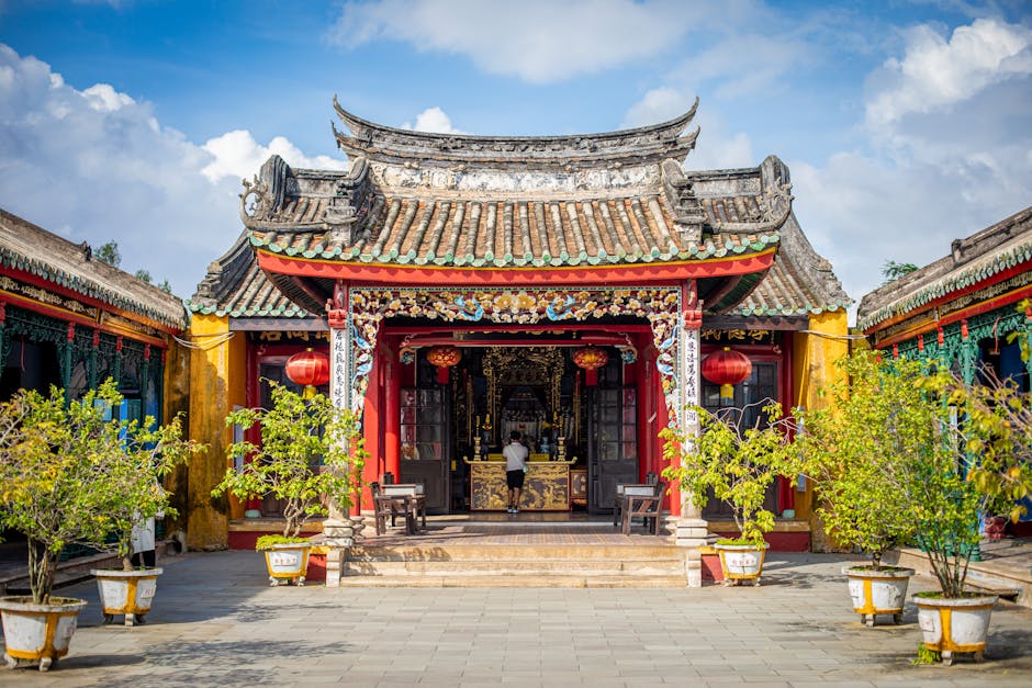 Beautifully ornate pagoda in Hoi An, Vietnam, showcasing traditional architecture and vibrant colors. in Ancient in Visit