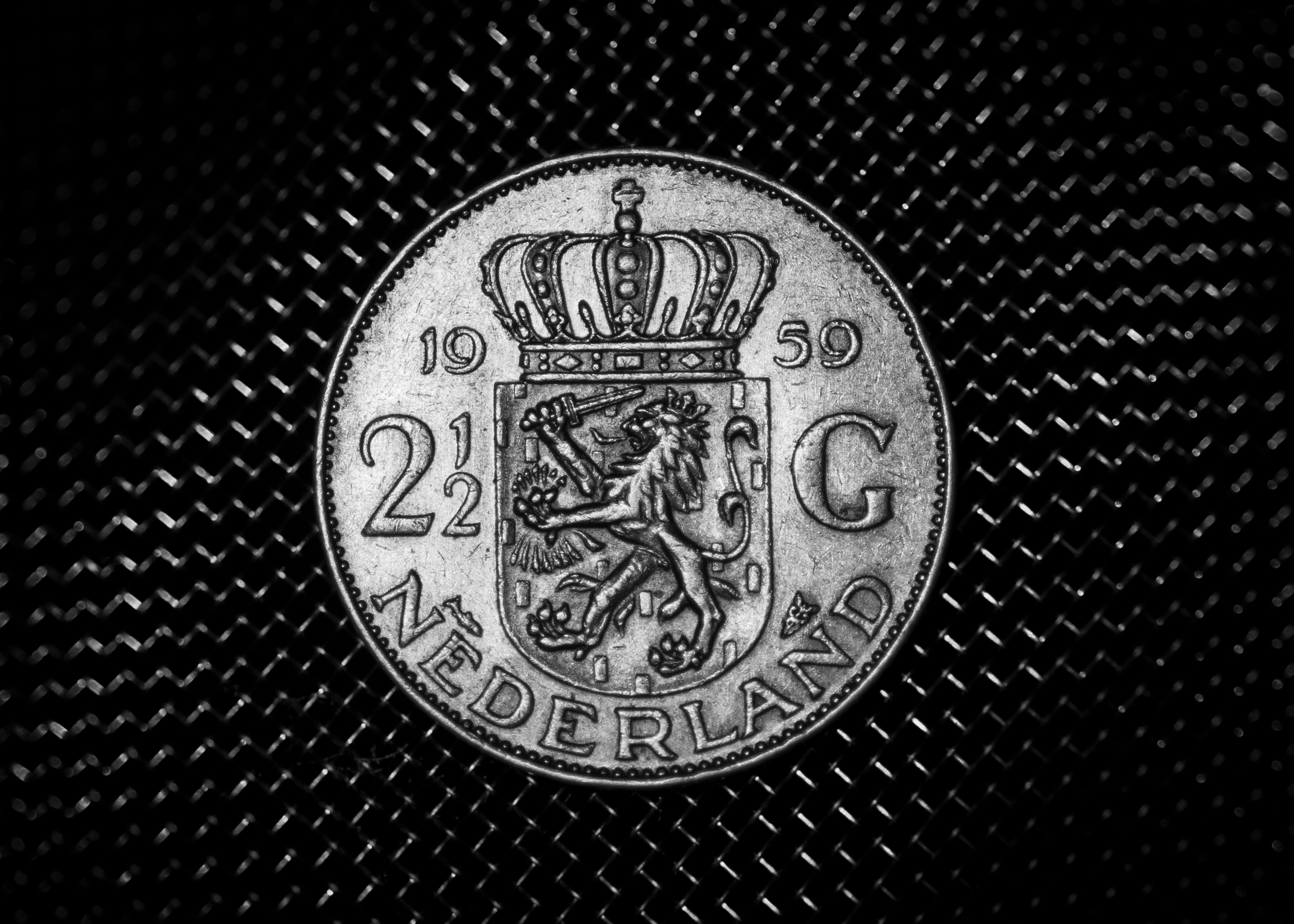 1959 dutch guilder coin on patterned surface