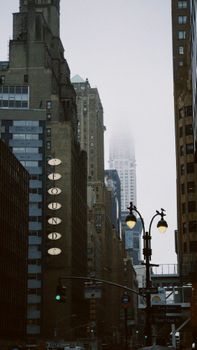 Moody urban scene featuring New York's skyline under the fog. Ideal for city-themed projects.
