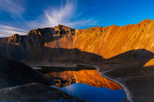 Breathtaking sunrise reflecting on a volcanic lake in Mexico.