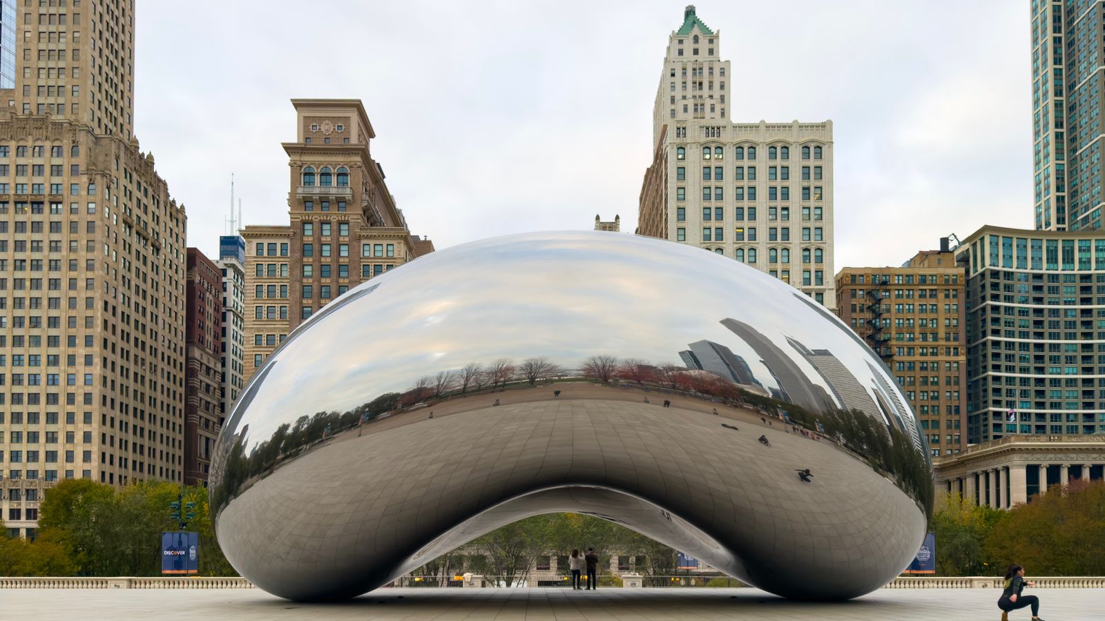 Chicago's Cloud Gate sculpture, known as The Bean, reflecting the city skyline in its polished steel surface, a real stock photo chosen because Dark Matter is set in Chicago and is about warped, alternate versions of the same life