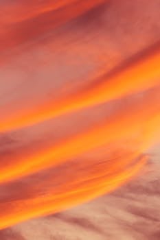 A breathtaking sunset in Akumal, Quintana Roo, Mexico with vibrant orange and pink sky colors.