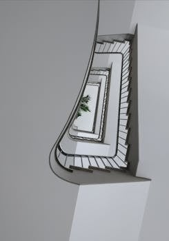 当代建筑内部鸟瞰图中，一个优雅现代的螺旋楼梯配有时尚的栏杆