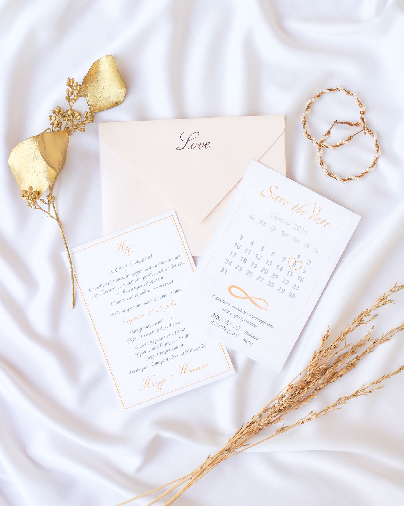 Elegant wedding invitation stationery on white fabric