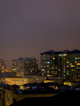 Evening view of residential high-rises in Baku, Azerbaijan, showcasing urban life.