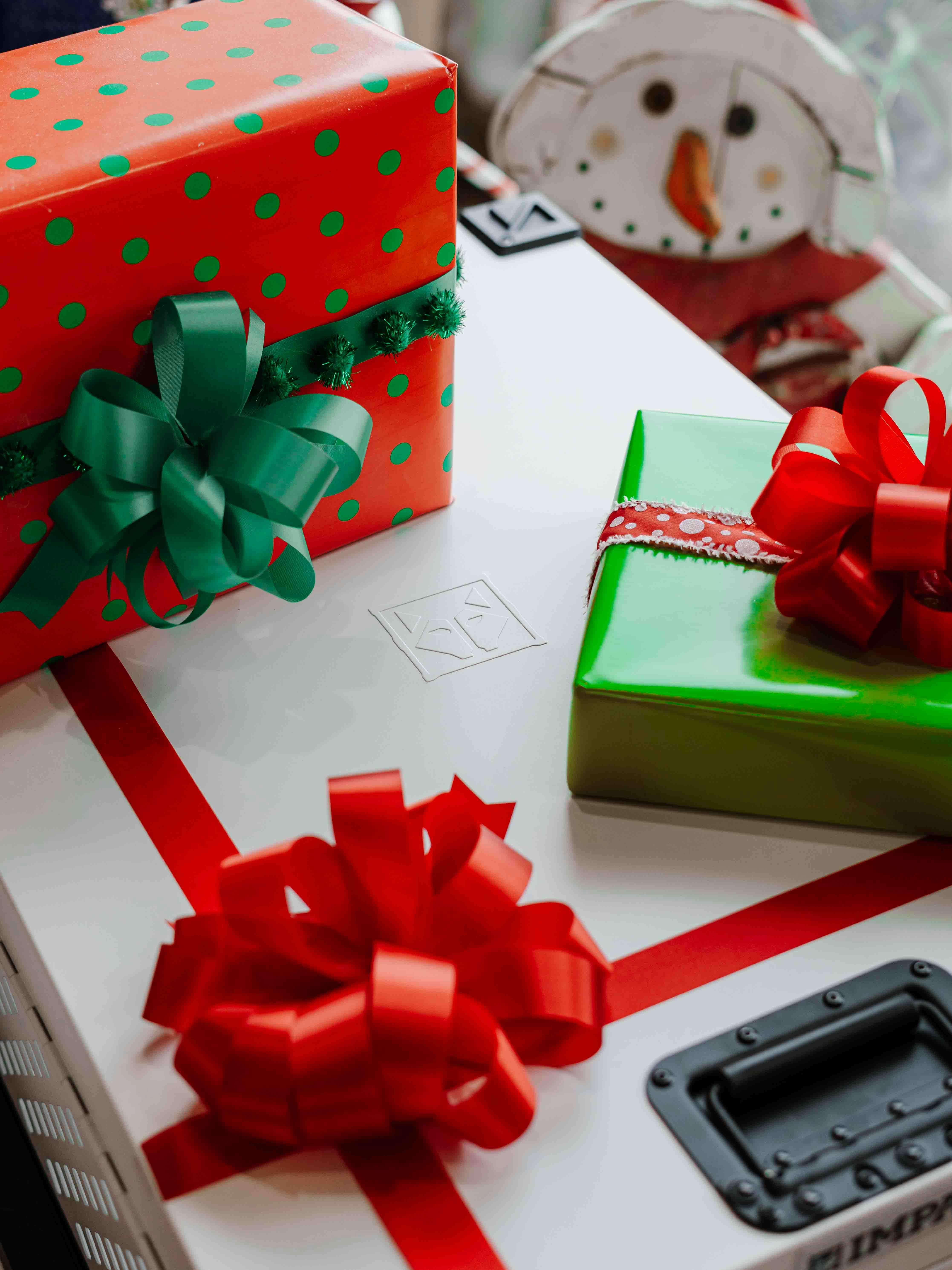 Colorful Christmas presents arranged with festive ribbons, creating a cheerful holiday atmosphere.
