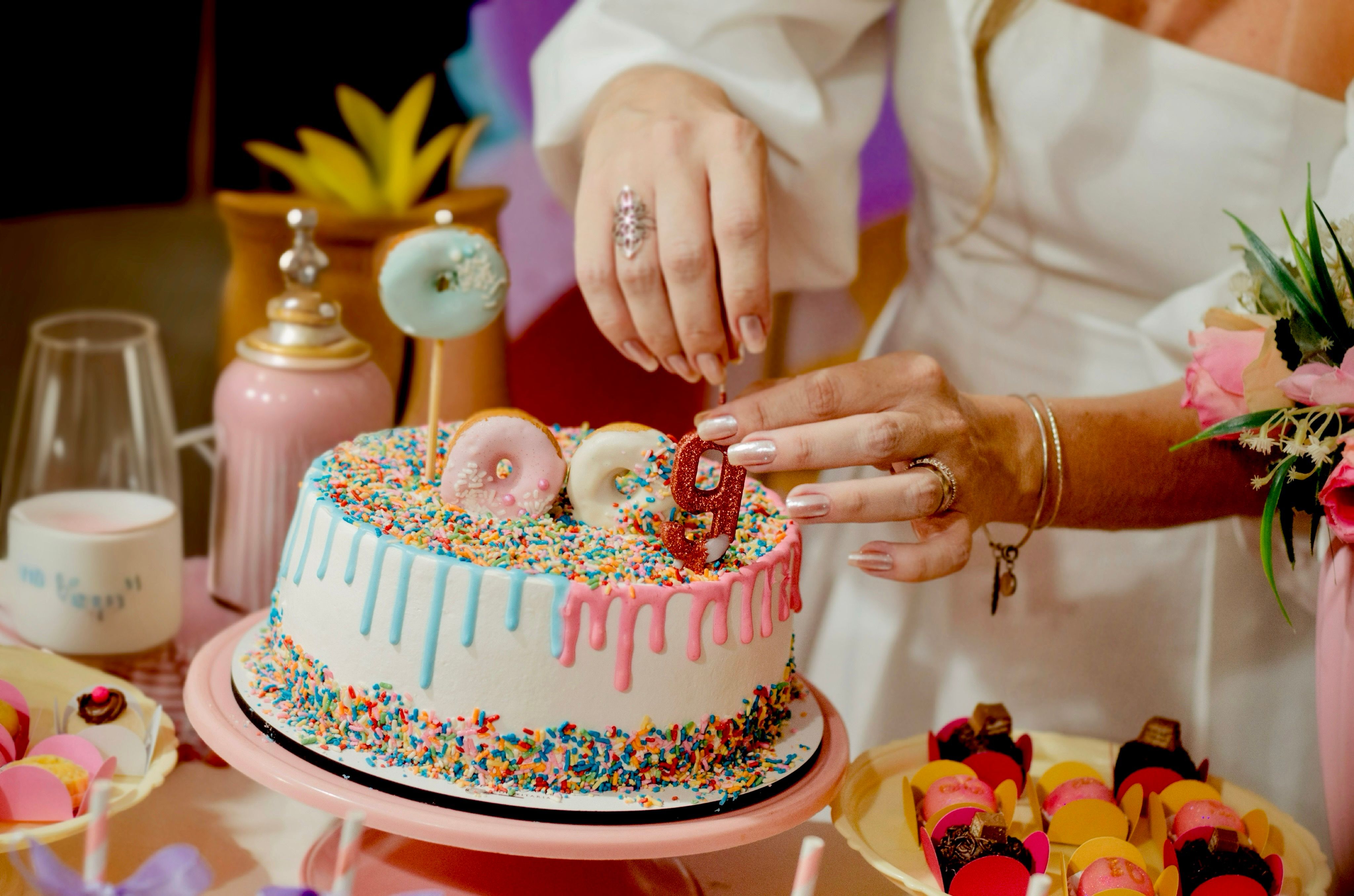 Colorful Birthday Cake with Sprinkles and Candles · Free Stock Photo