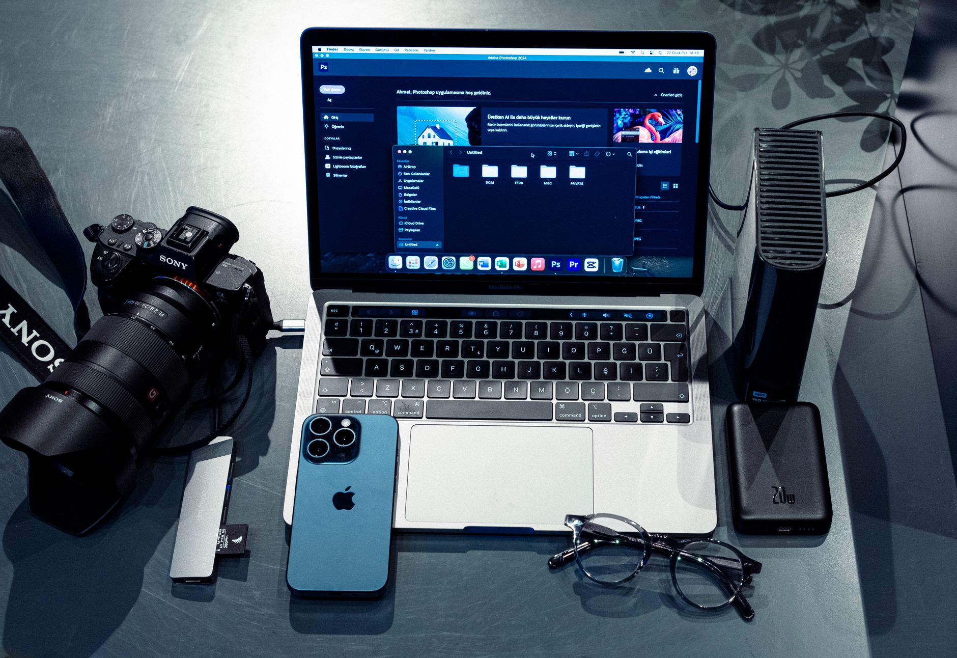 Best cloud backup for photographers: workspace with laptop, camera and phone