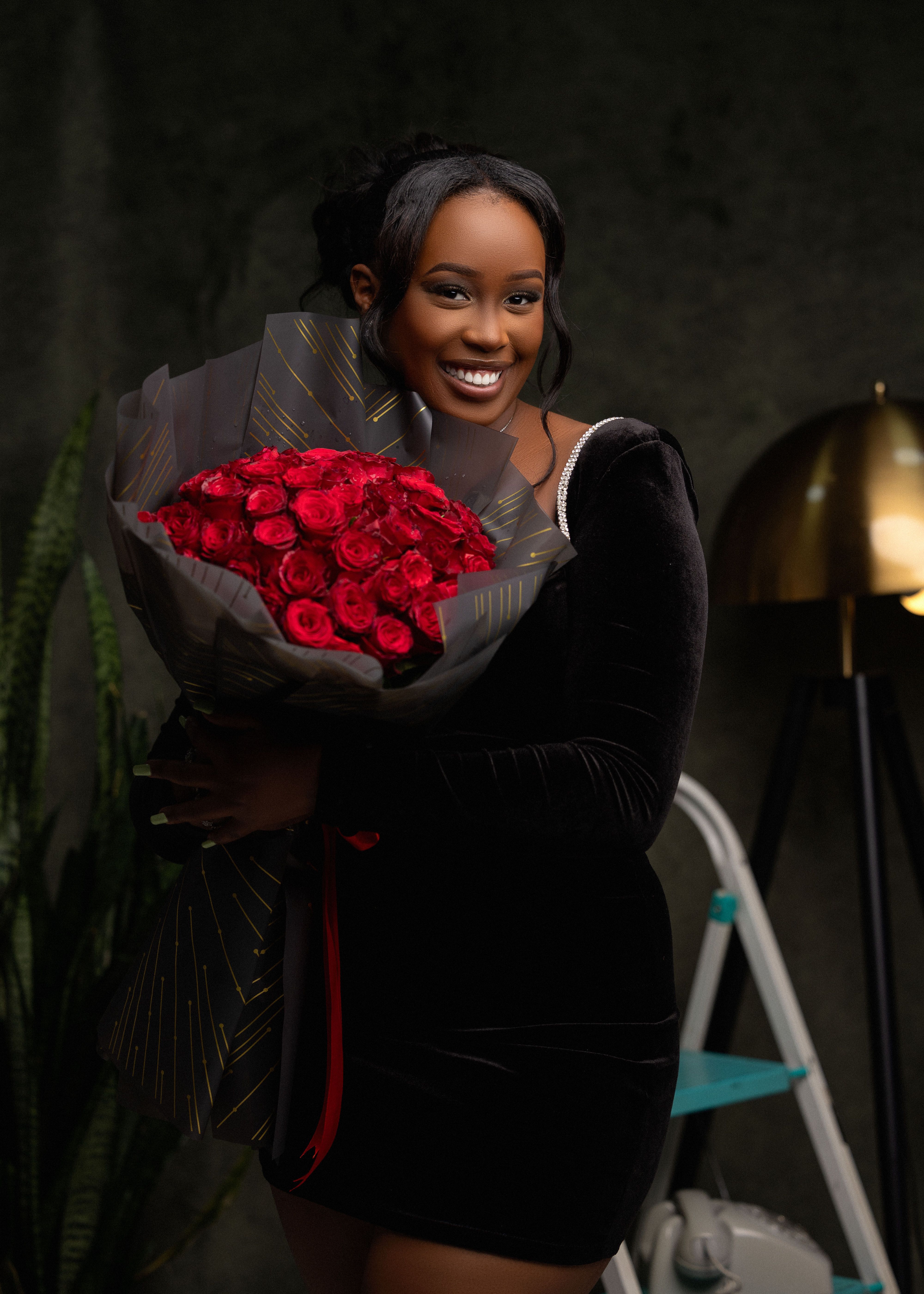 Elegant Portrait of Woman Holding Red Roses · Free Stock Photo