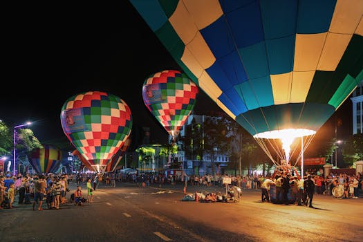 Colorful hot air balloons illuminate the night at a festival in Long Xuyên, Vietnam.