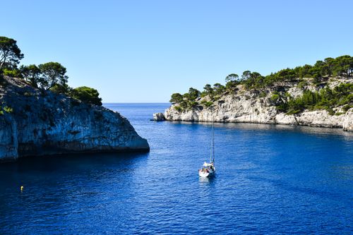 Free Explore the stunning calanques with a sailboat in clear blue waters of Provence-Alpes-Côte d'Azur, France. Stock Photo
