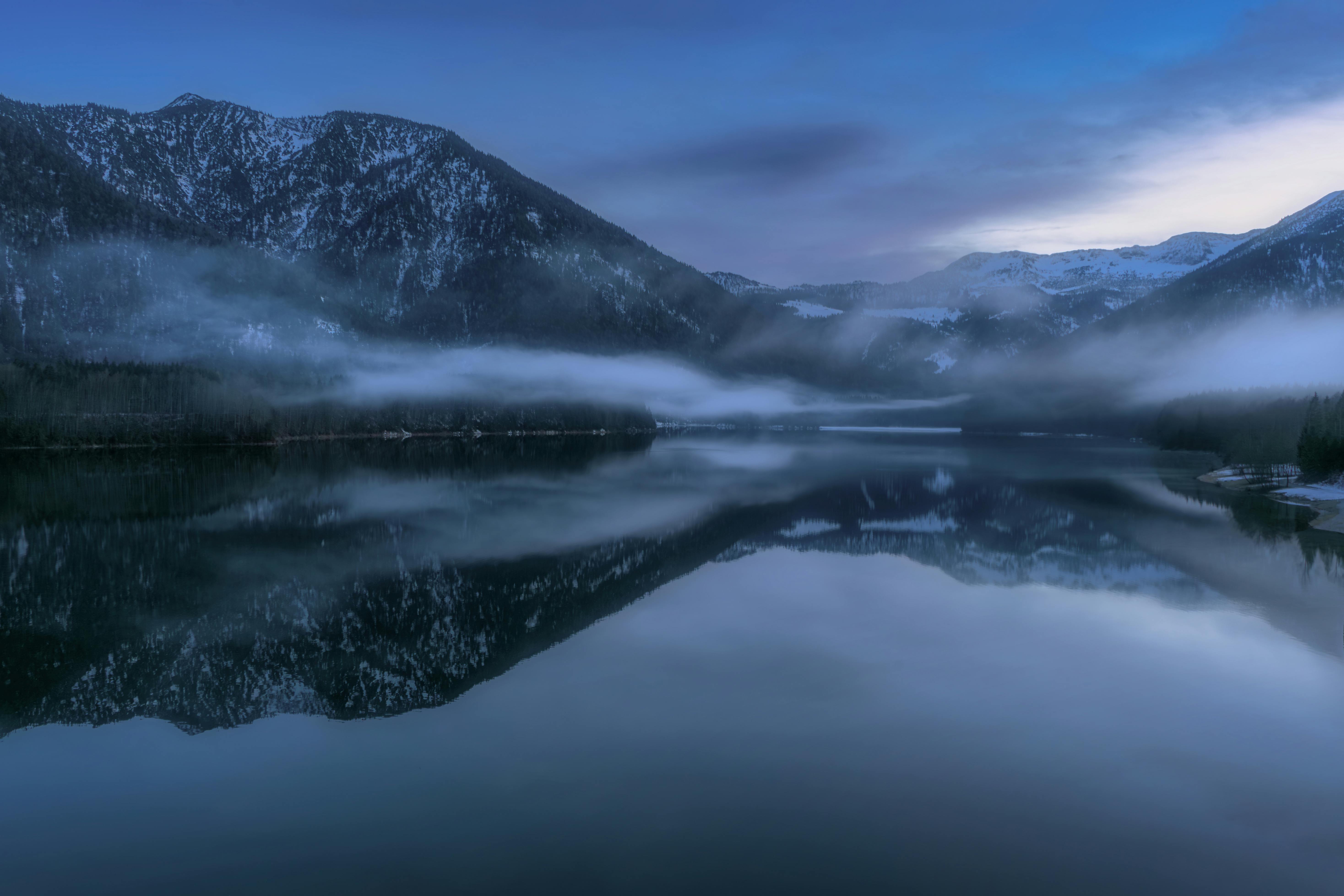 tranquil misty mountains in bavaria at dawn