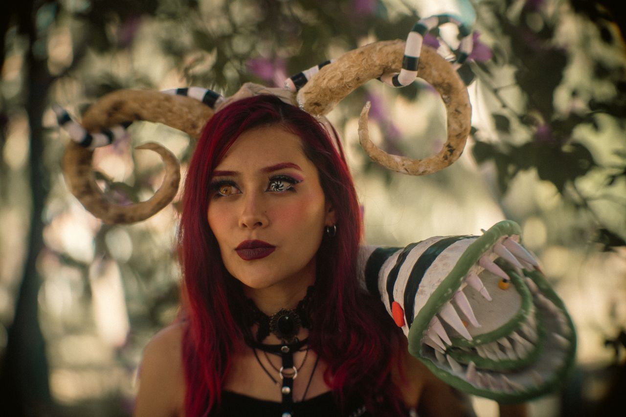 a woman in fantasy cosplay with horns in a forest setting in mexico ci