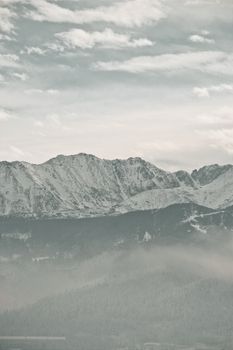 Serene winter view of the Tatra Mountains with snow-capped peaks in Zakopane, Poland.