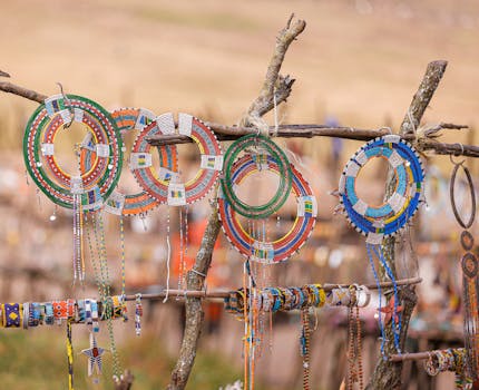 Vibrant Maasai beaded jewelry displayed on wooden racks in Ngorongoro, Tanzania.