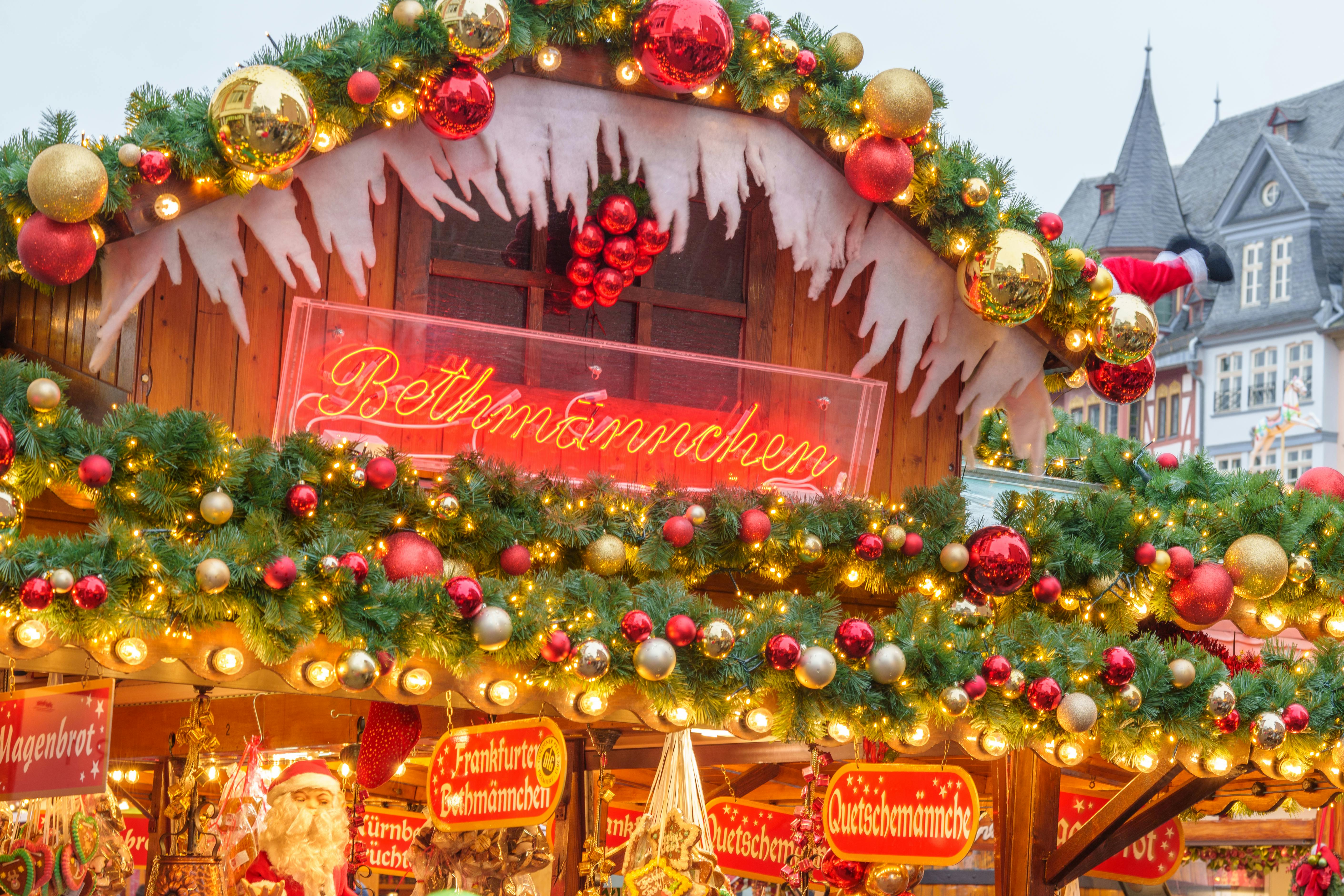 festive christmas market stand decorated with lights