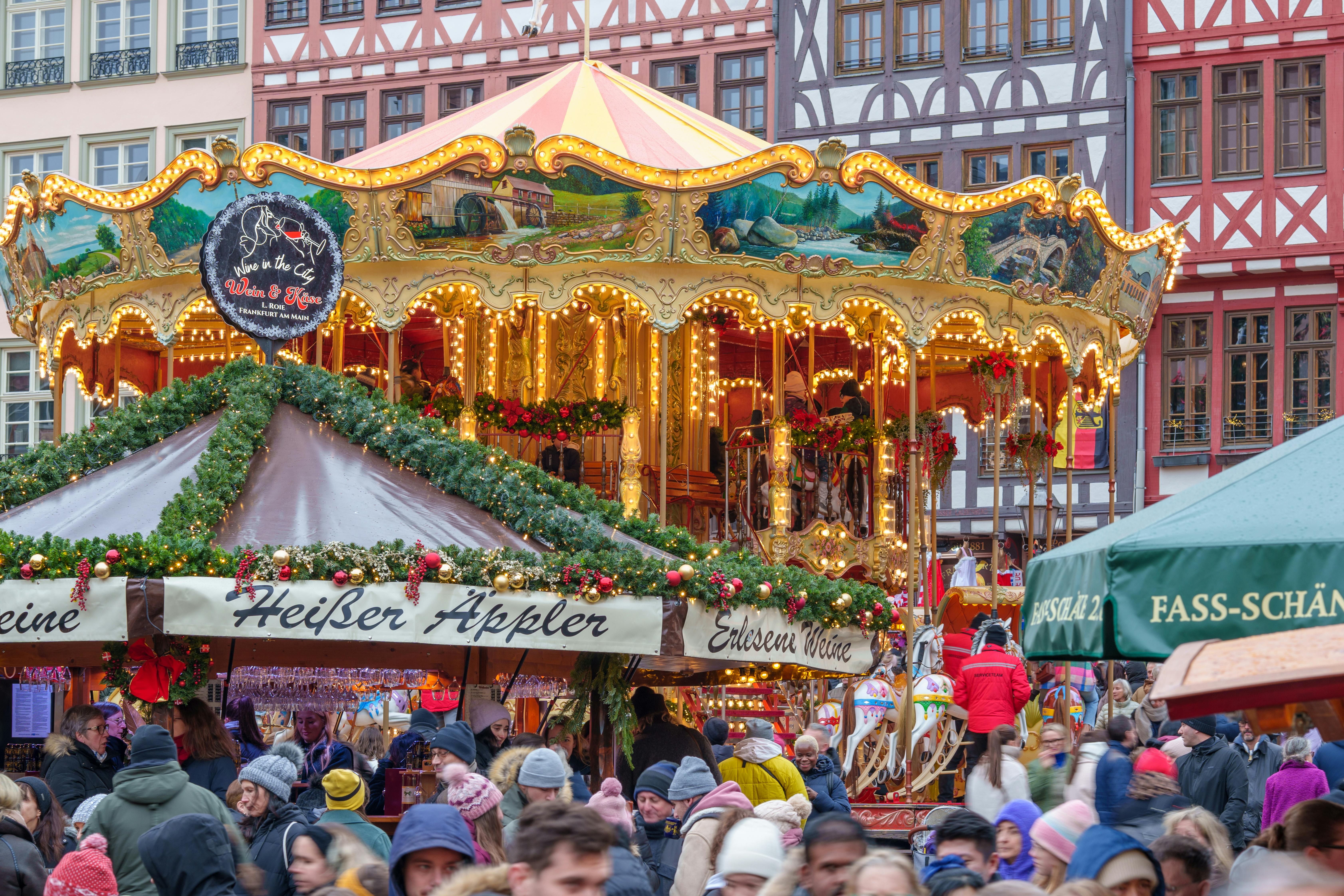 colorful holiday market carousel with people