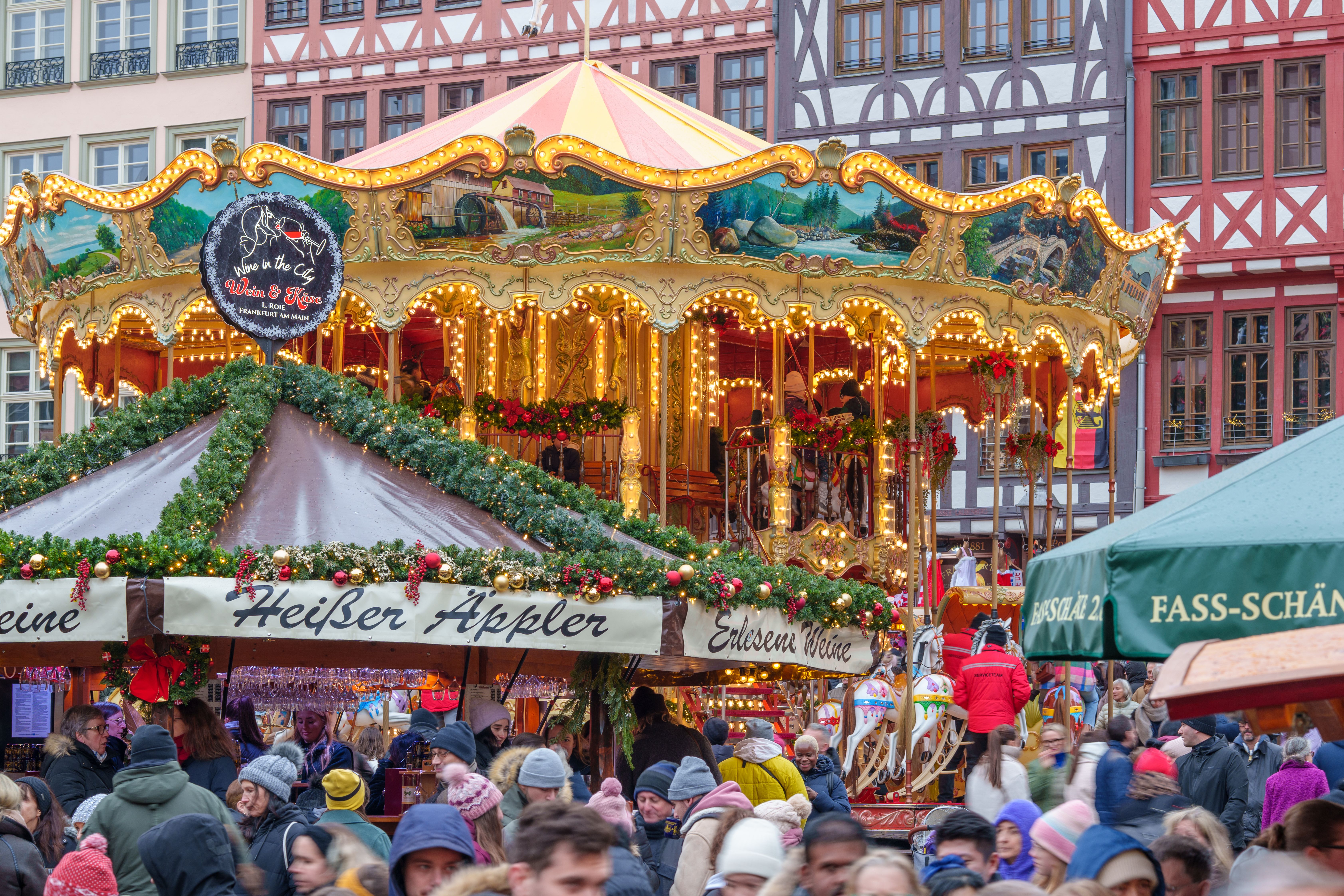 Colorful Holiday Market Carousel with People · Free Stock Photo