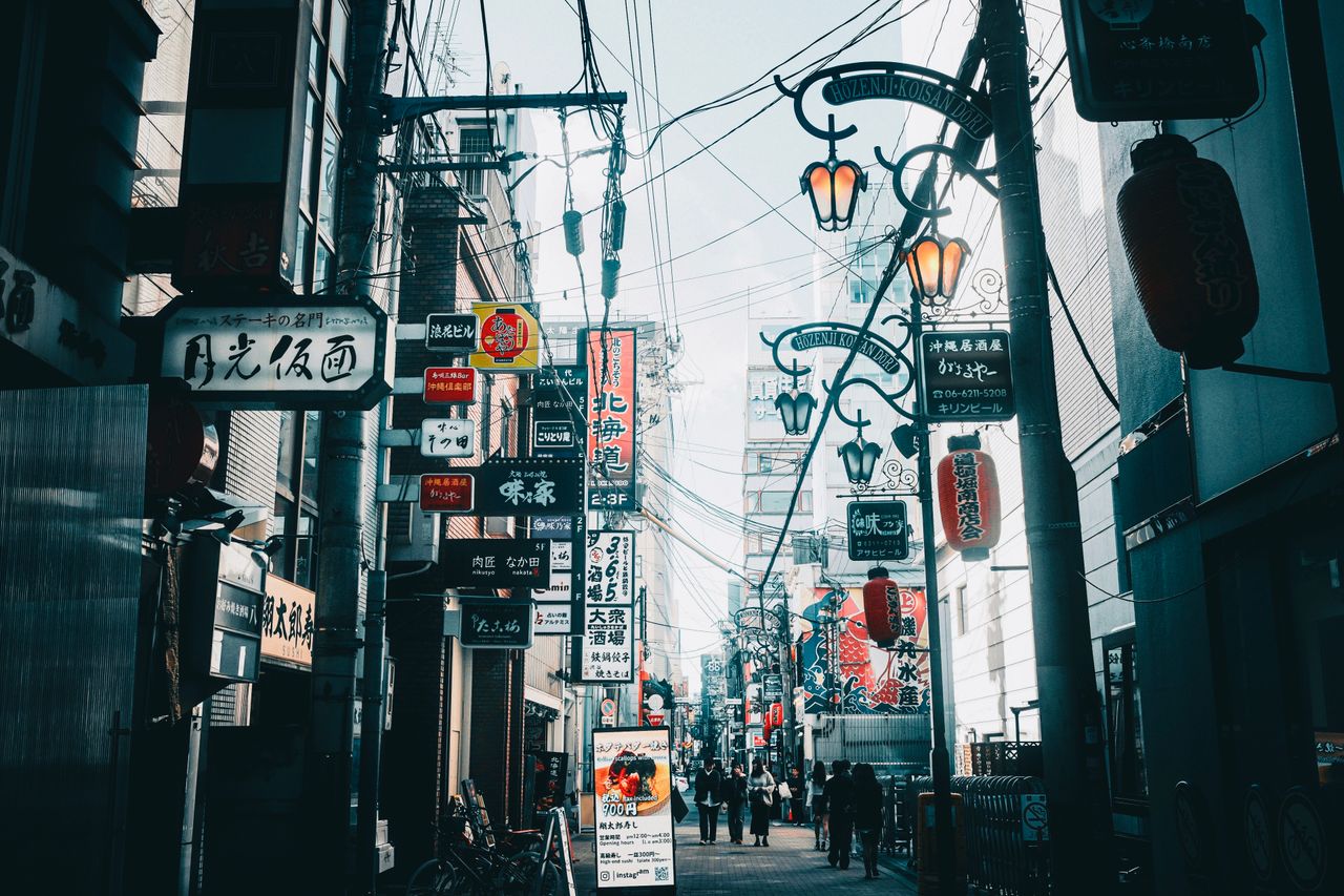 vibrant street scene in japan showcasing neon signs and urban life