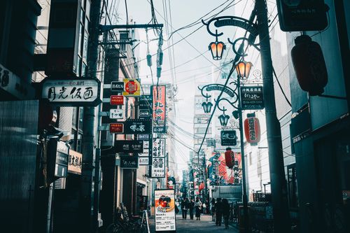 Free Vibrant street scene in Japan showcasing neon signs and urban life. Stock Photo