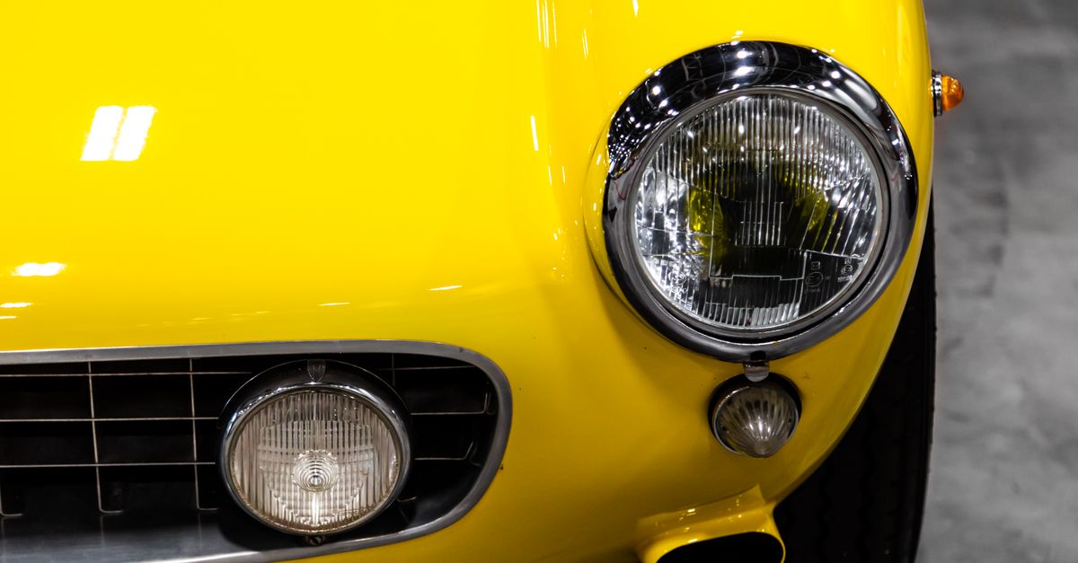 Close-up of a Yellow Vintage Racing Car Headlight · Free Stock Photo