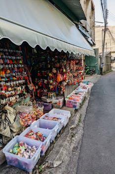 A vibrant street market display of souvenirs in a narrow alleyway, perfect for travelers and tourists.