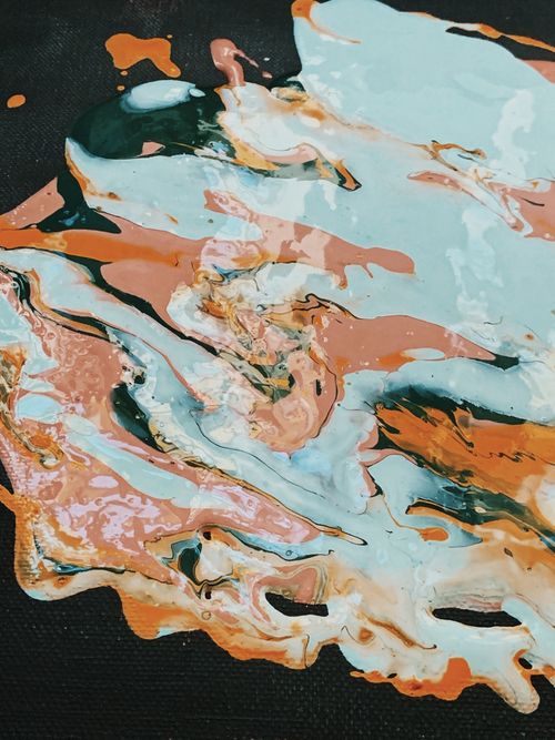 Free A colorful abstract acrylic painting showcasing dynamic swirls and textures on canvas. Stock Photo