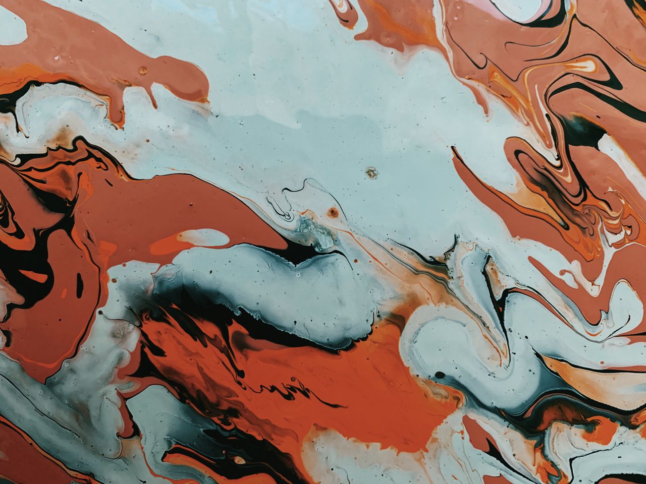 dynamic abstract painting with swirling red and blue patterns showcasi