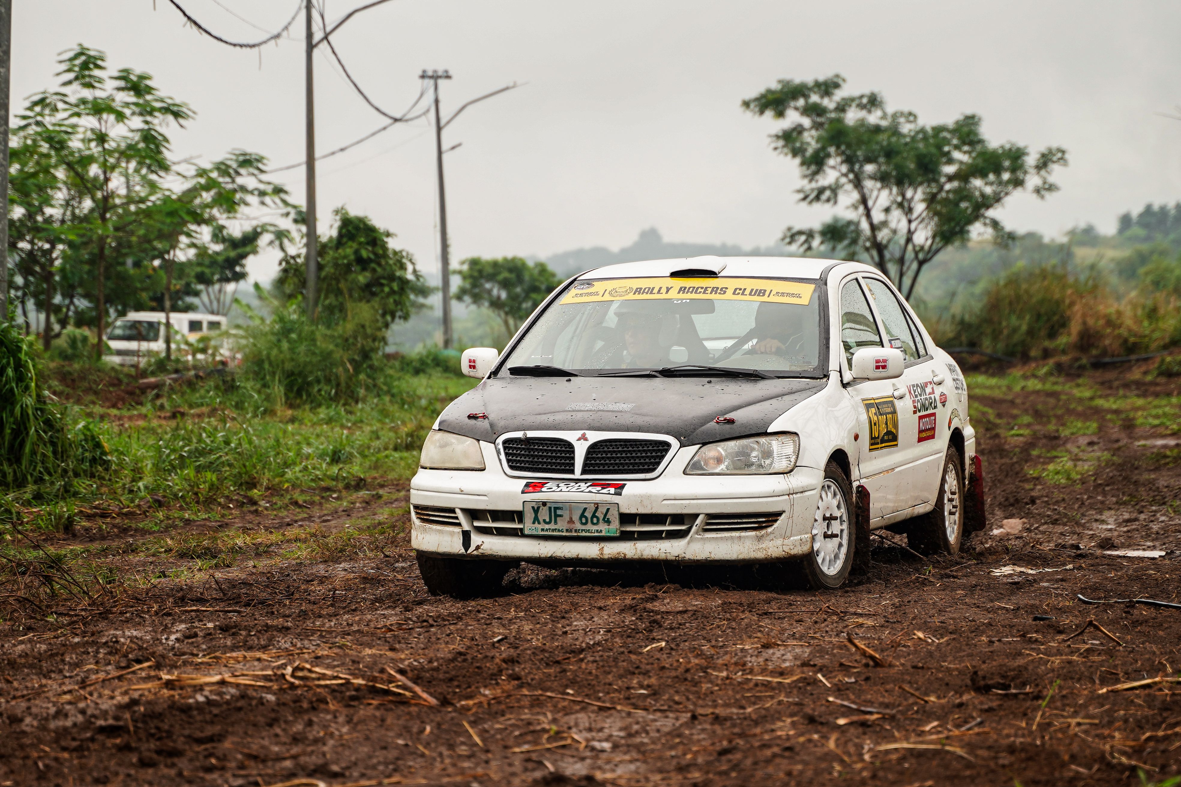 Rally Car Driving Through Muddy Terrain in Baras · Free Stock Photo