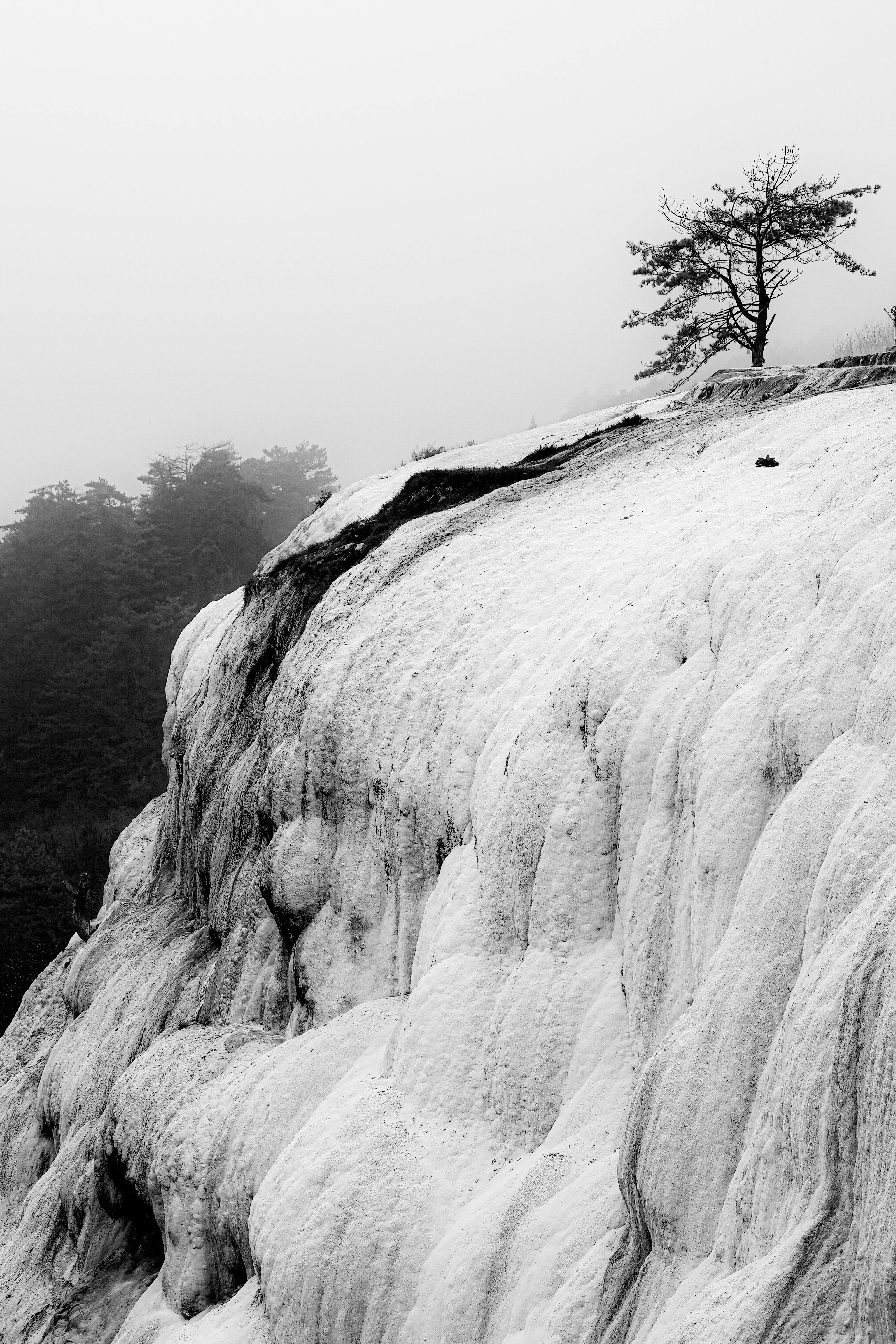 Misty black and white capture of Bolu's natural travertine landscape in Turkey.