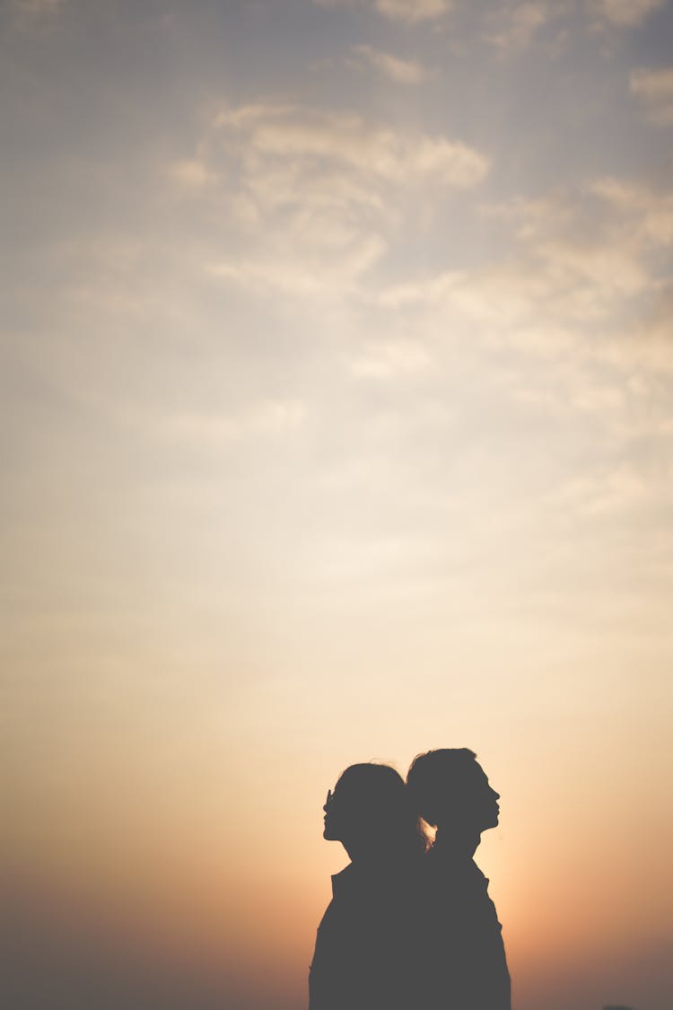 Silhouette Of Man And Woman At Sunset