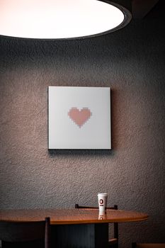 Stylish interior with pixel heart artwork and cozy lighting in Yalova, Türkiye.